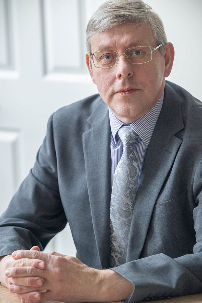 Colin Holburn suit sitting 010